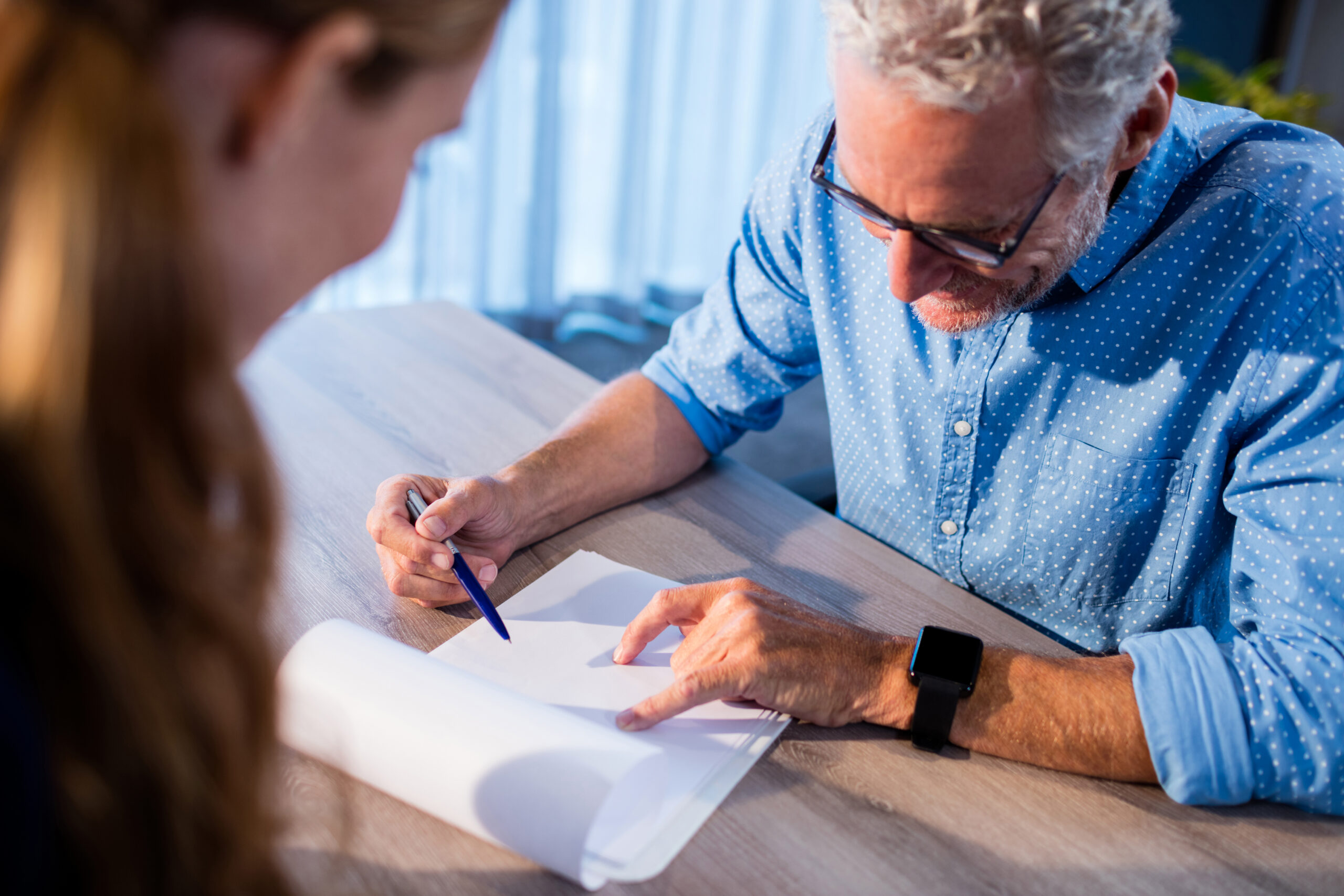 Businessman reading a document in the office