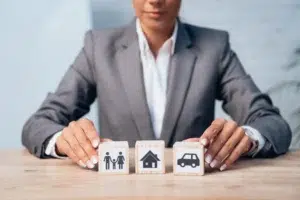 cropped-view-of-woman-touching-wooden-cubes-with-f-